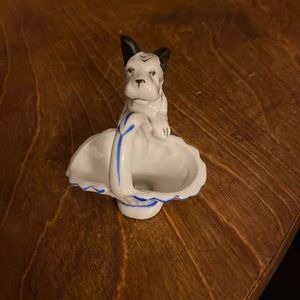 Small white terrier with basket for trinkets, rings or a flower.